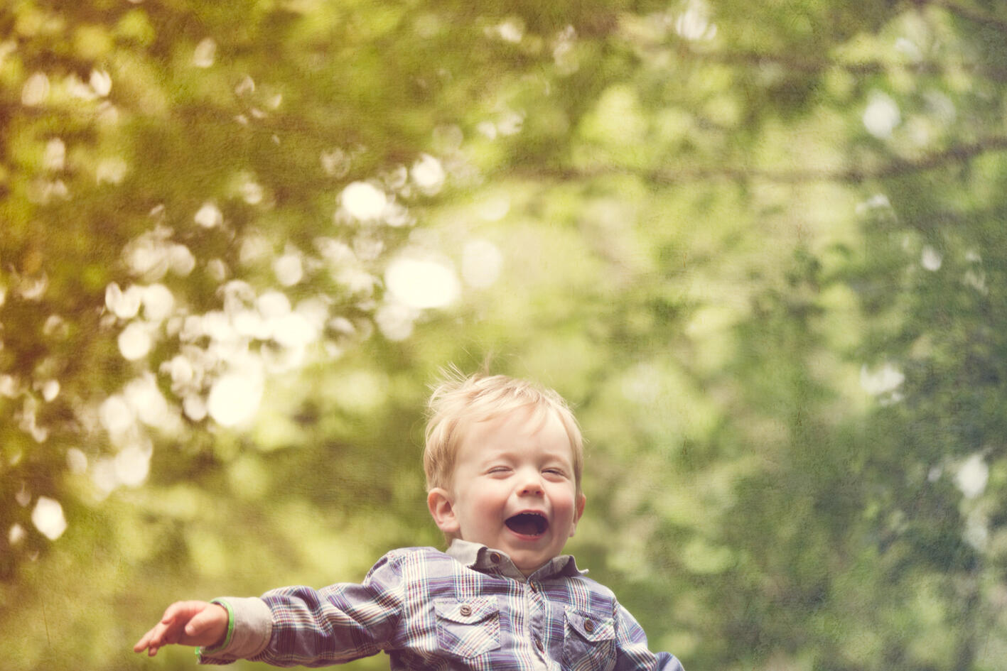 Happy kid A beautiful image of a little boy happily being thrown in the air
